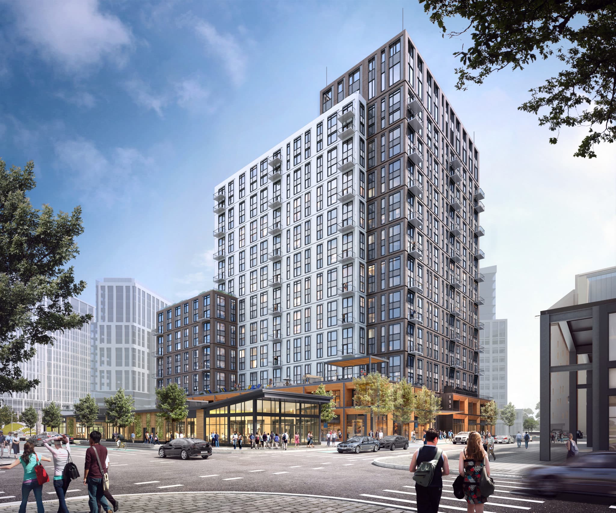 Mixed-use residential high-rise in Cambridge Crossing with bustling street life and modern design