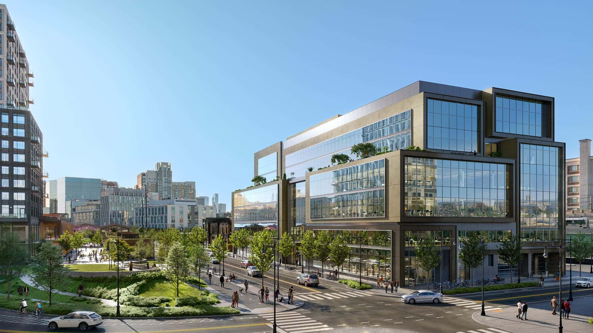 Sleek modern office building with stacked glass volumes overlooks landscaped streetscape and intersection