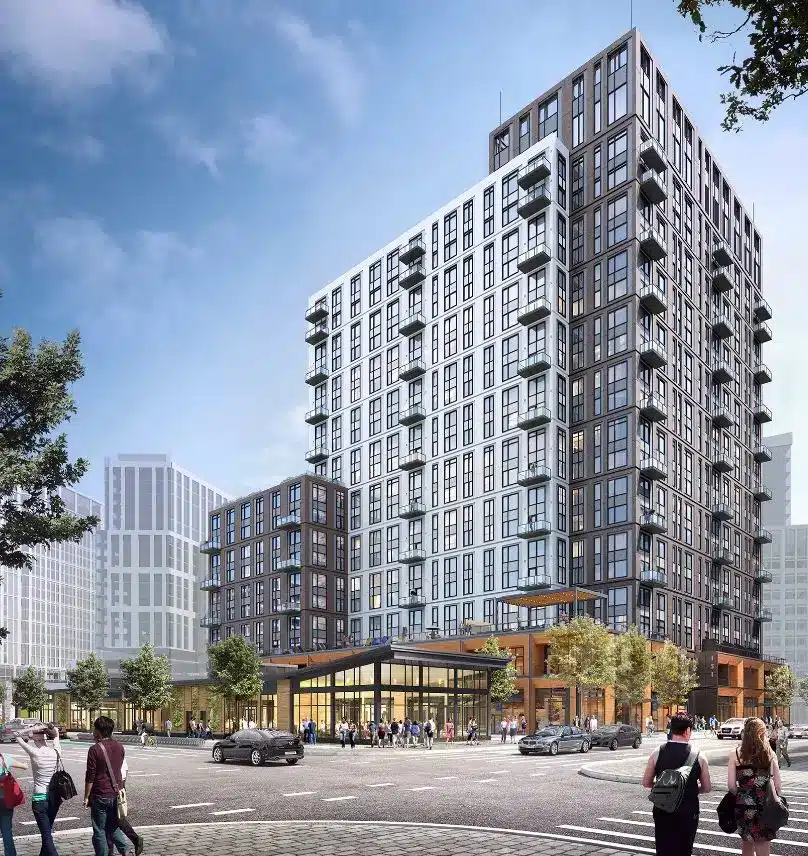 Mixed-use tower rises above bustling retail plaza at pedestrian-friendly urban street intersection