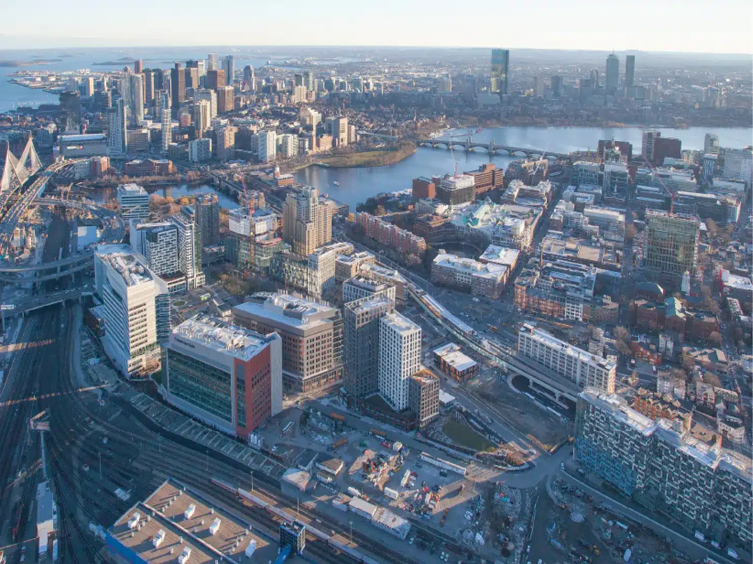 Aerial view of Kendall Square and Cambridge Crossing developments with Boston skyline in background