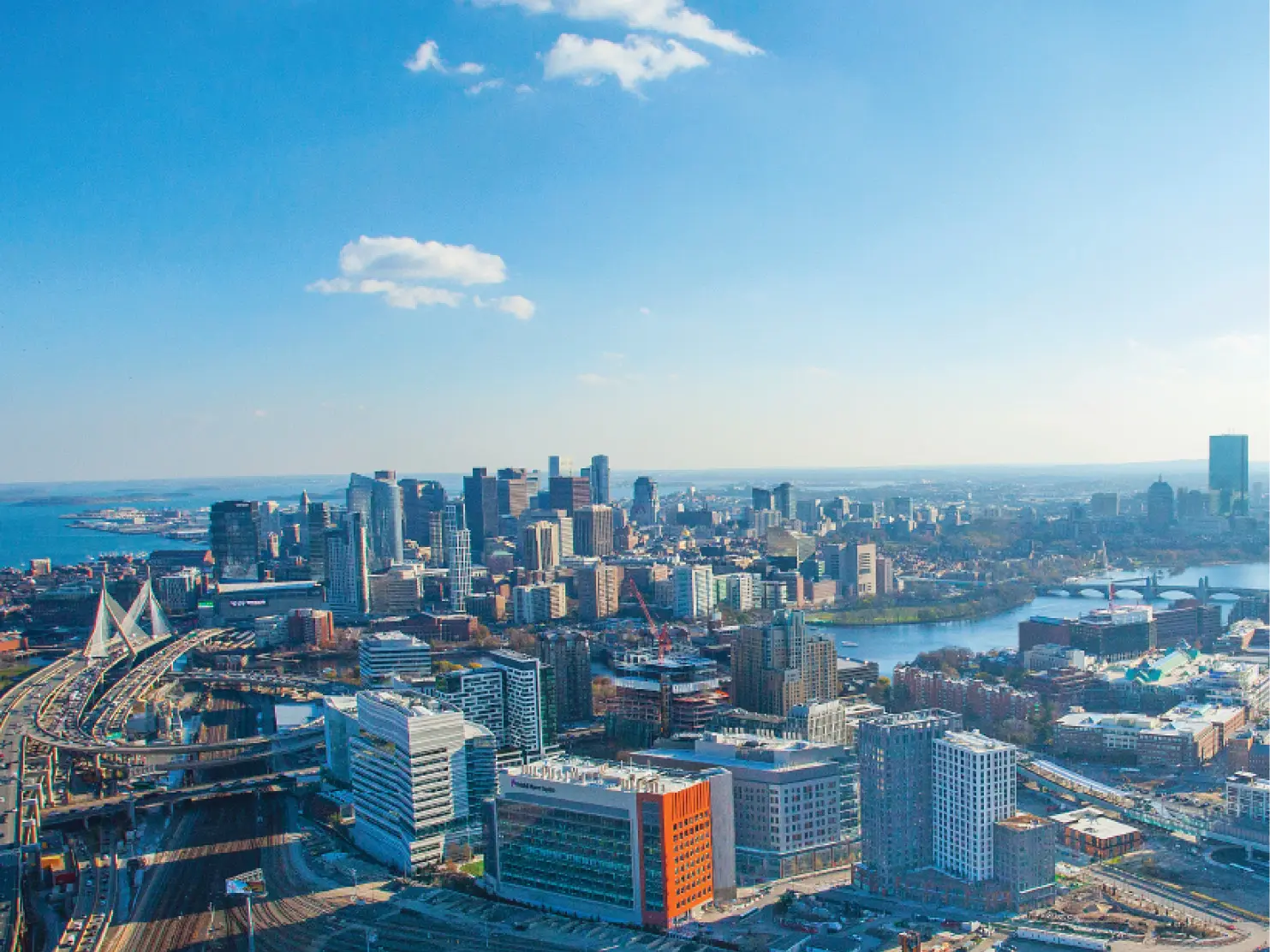 Aerial view of Boston skyline and Cambridge Crossing near Charles River and Zakim Bridge