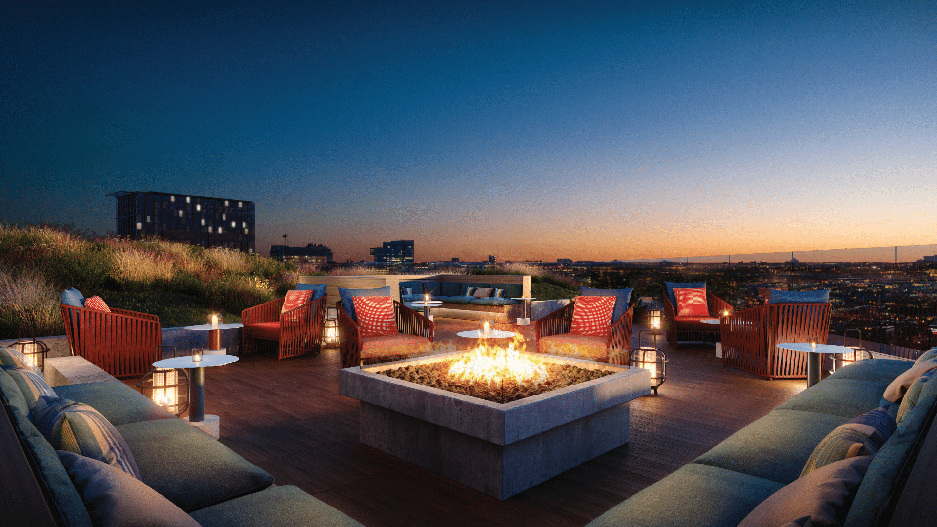 Rooftop firepit lounge at twilight with cozy seating, city skyline views, and ambient lighting