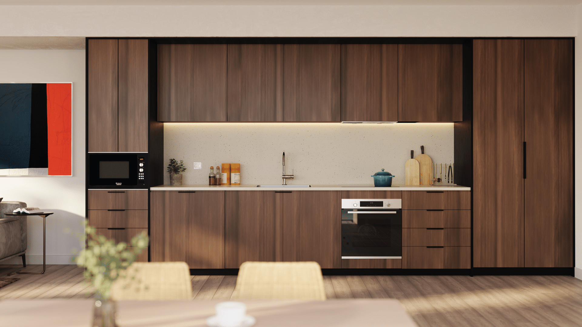 Sleek studio kitchen with full-height wood cabinets, integrated appliances, and minimalist backsplash