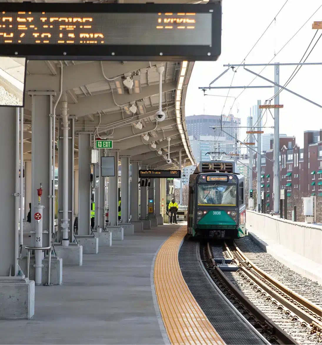MBTA Green Line train arriving at Union Square station with digital signage and safety platform edge
